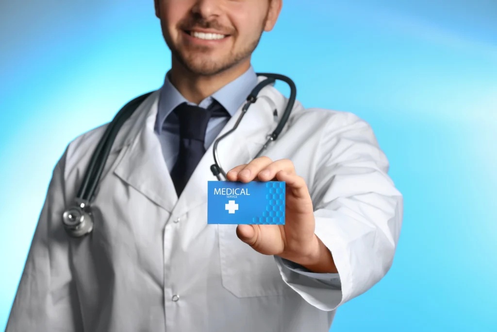 smiling doctor holding medical service card in cli 2026 03 05 18 40 57 utc